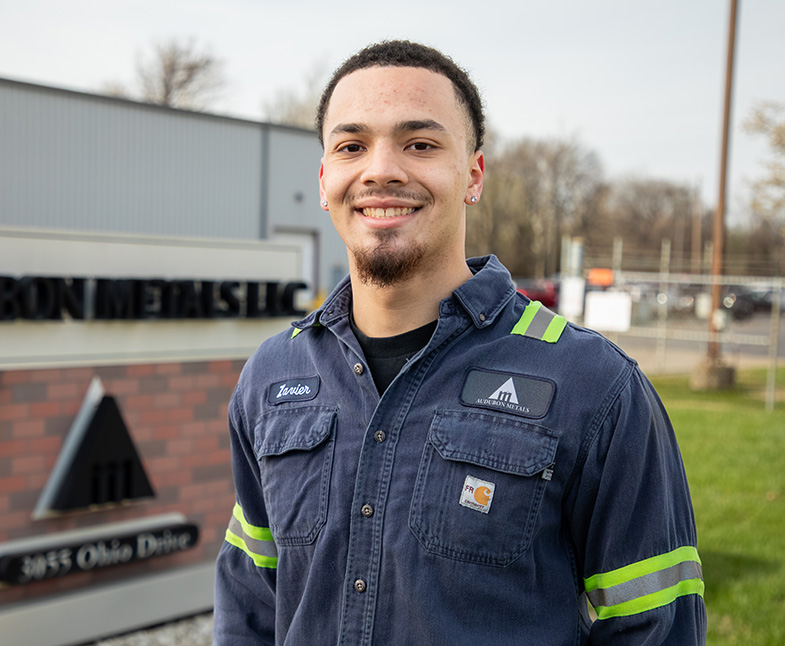 Man standing outside of a manufacturing company