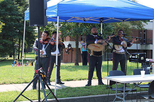 picture of a mariachi band playing under a tent