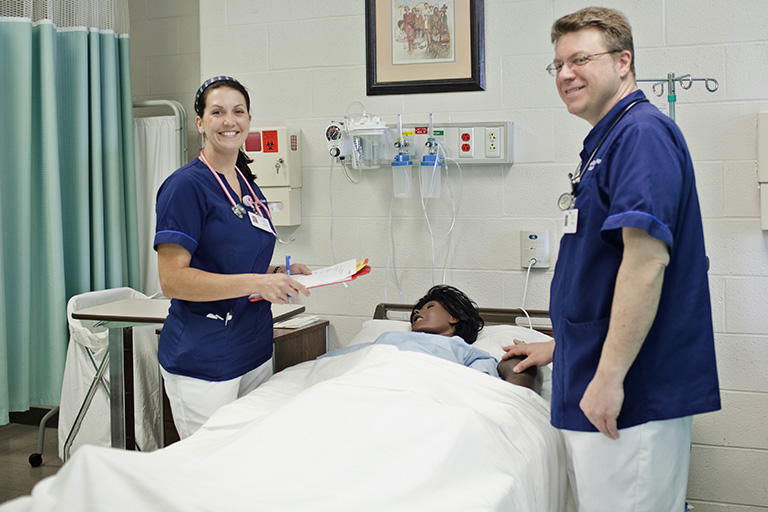 Two nursing students in a lab