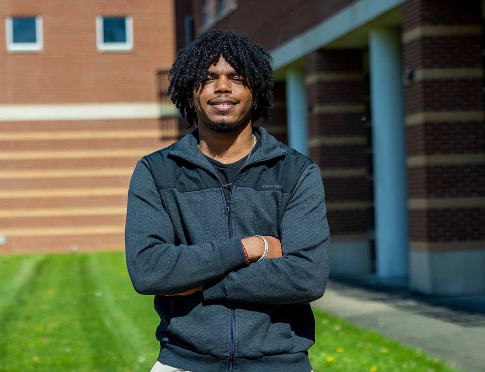 HCC student standing outside the STC building