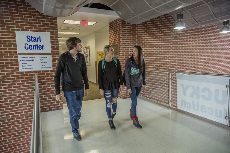Students walking in a hallway. 