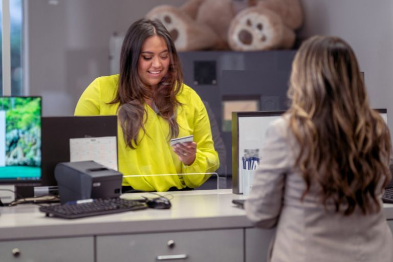 a student being helped in a business office