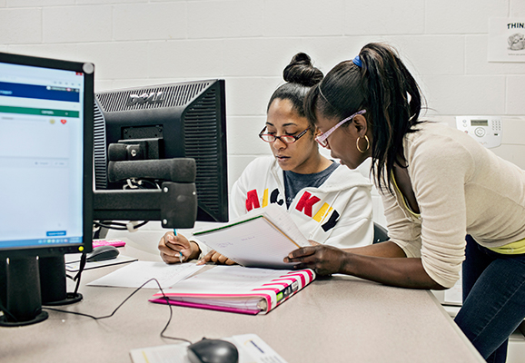 two students at a computer terminal