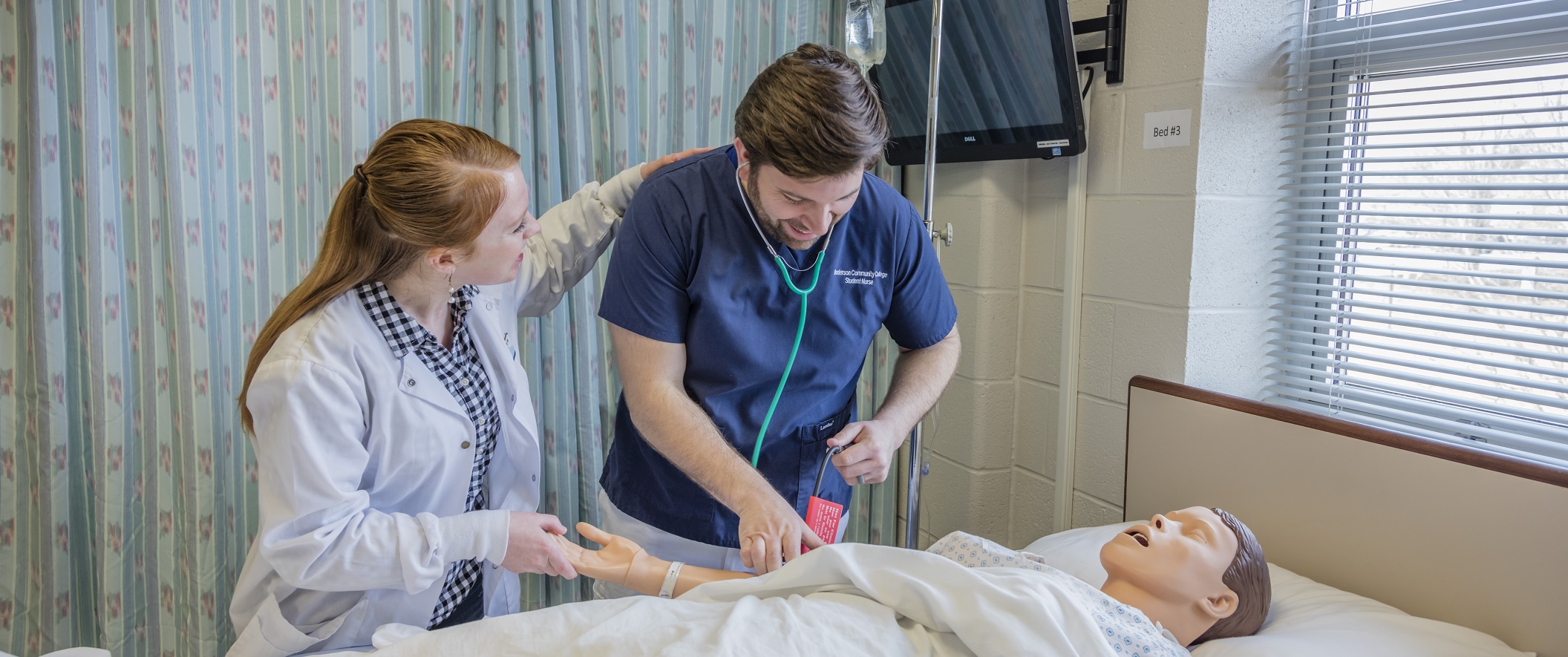 Nursing students check pulse