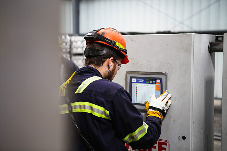 Manufacturing Student on High Tech Equipment