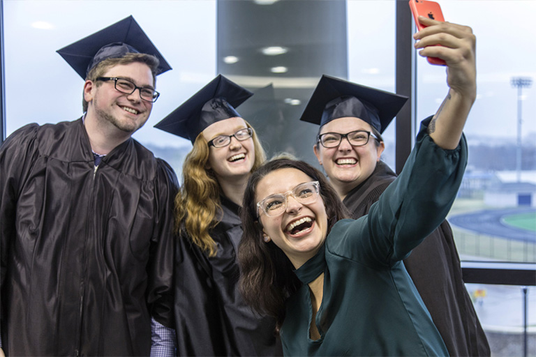 graduates posing for a selfie